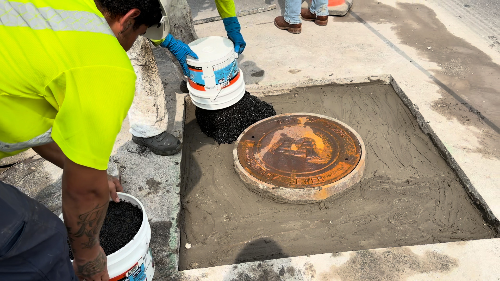 Mortar collar troweled around the manhole frame to bring it back to grade
